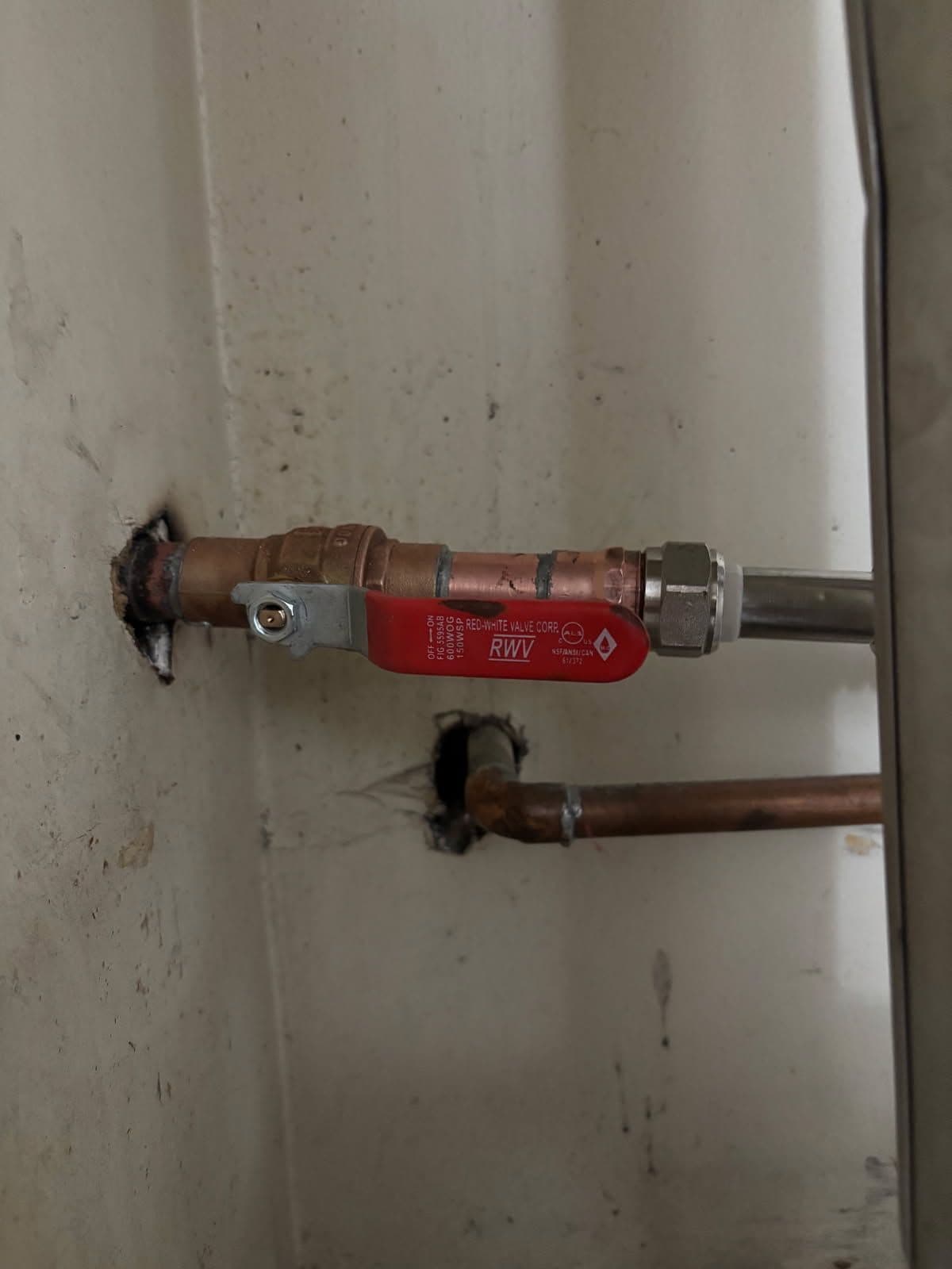 Old Leaking Water Heater Valve Replaced With a New Ball Valve