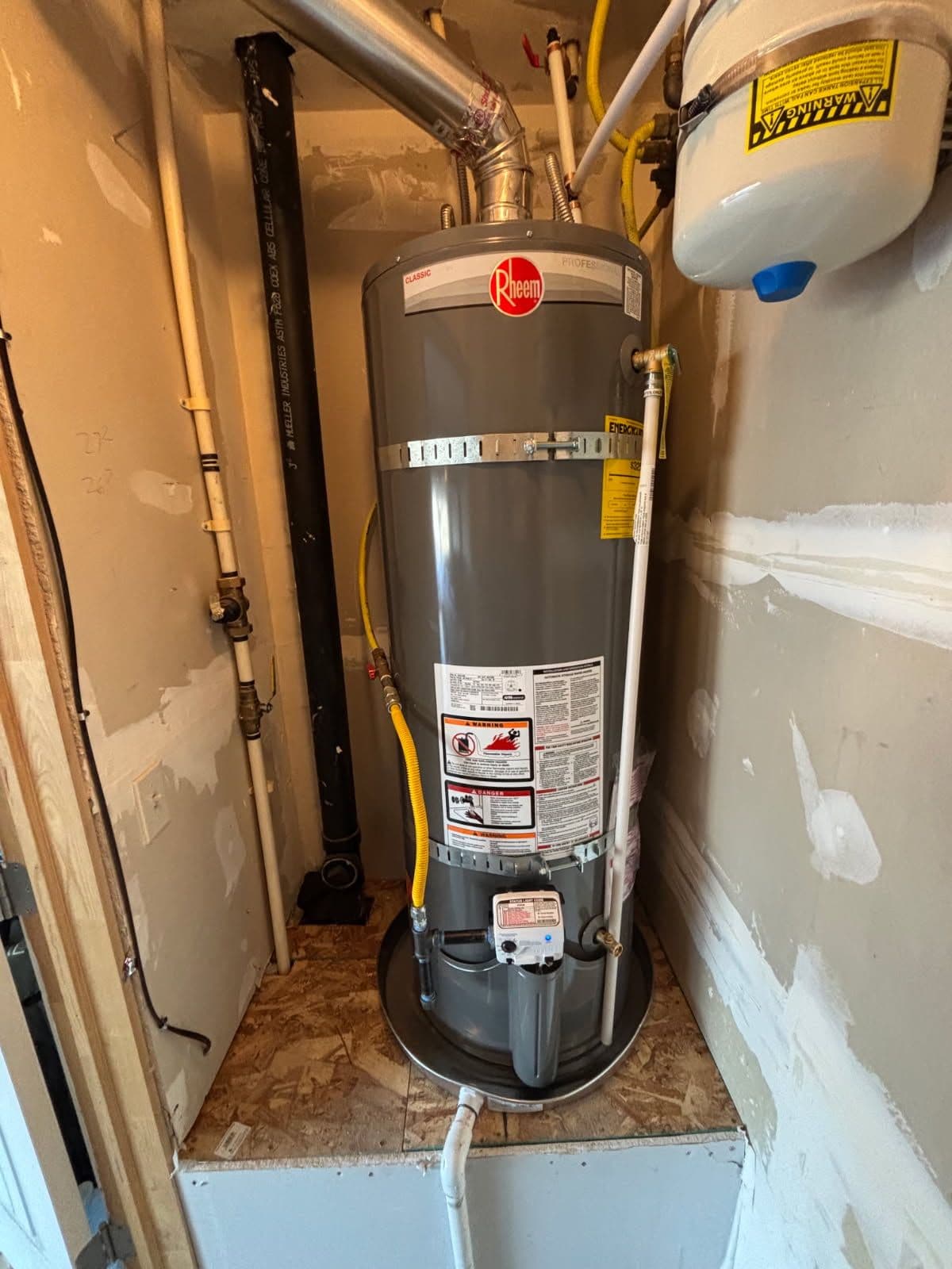 Gallery photos for Efficient Water Heater Installation with Added Floor Protection: Image #2
