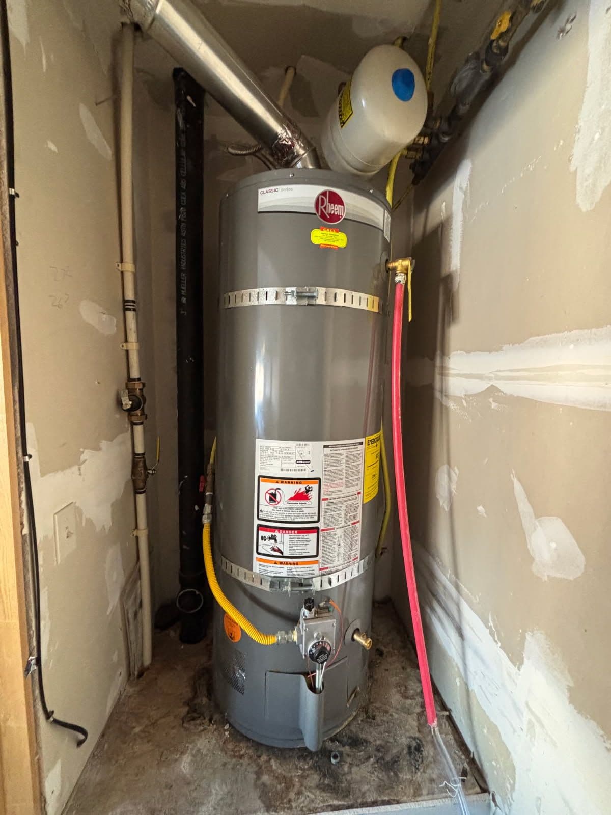 Gallery photos for Efficient Water Heater Installation with Added Floor Protection: Image #3