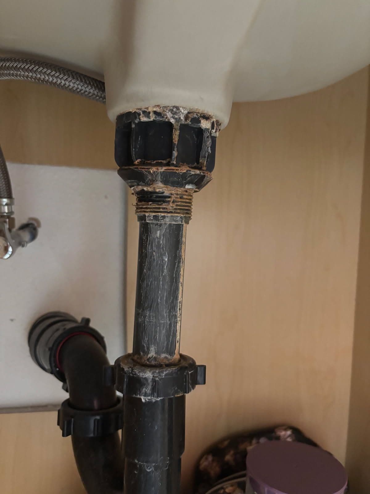 Gallery photos for Leaking P-Trap Replacement Stops Cabinet Water Damage: Image #1